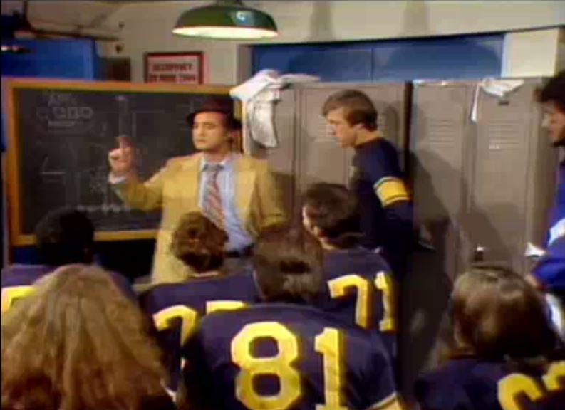 a group of football players in a locker room