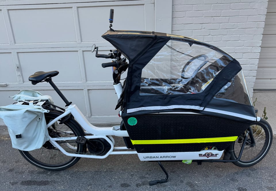 a bicycle with a baby carrier