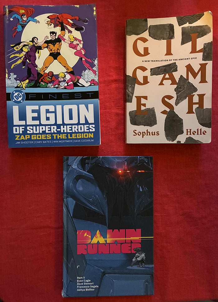 A picture of the three books I read this last month, on a red tablecloth.