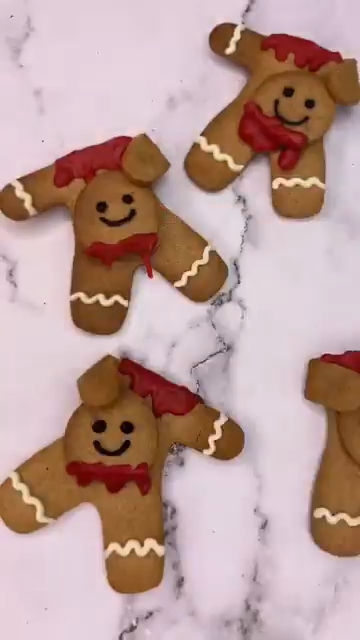Decapitated gingerbread men holding their own bloodied heads