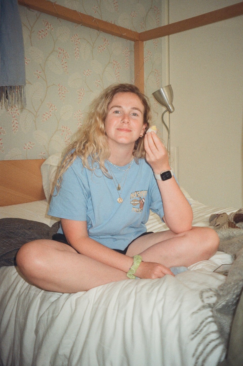 a girl sitting on a bed