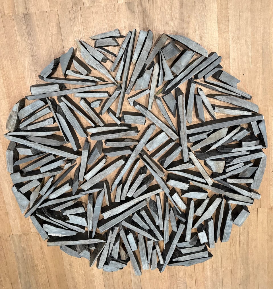 Photo of circle composed of flint, an artwork by Robert Long at the Tate Modern
