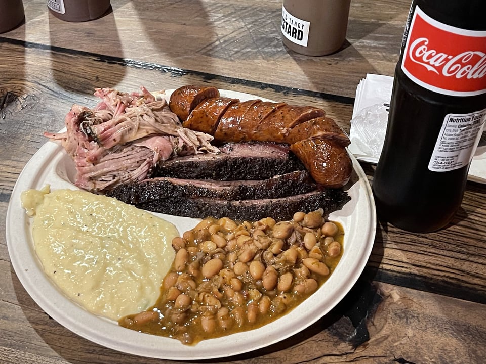 Pork rib, cheddar+jalapeno sausage, brisket, beans, grits, and a Mexican Coke.