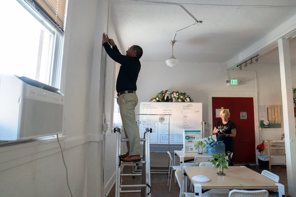 Atniel installing a Wi-Fi access point.