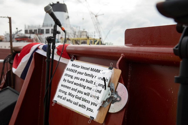 A photo of the launch uh speech or something for the MV Mark W Barker, which reads Motor Vessel Mark W Barker your family name is strong, you are built strong by hard working men and women and you will work strong May God bless you and all who sail with you.