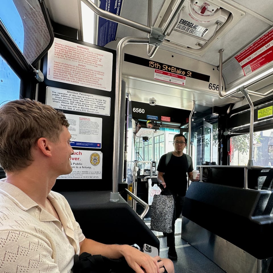 Steve and a surprised Norton on a bus.