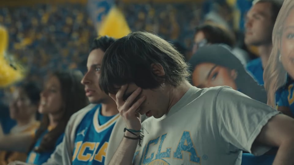 A UCLA fan from a State Farm commercial buries his face in his hand.