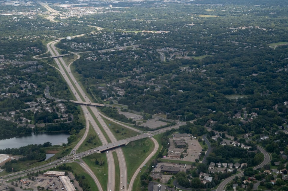 Aerial image of interstate with several interchanges.