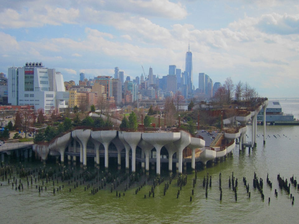 A floating park in the Hudson River against the Manhattan skyline
