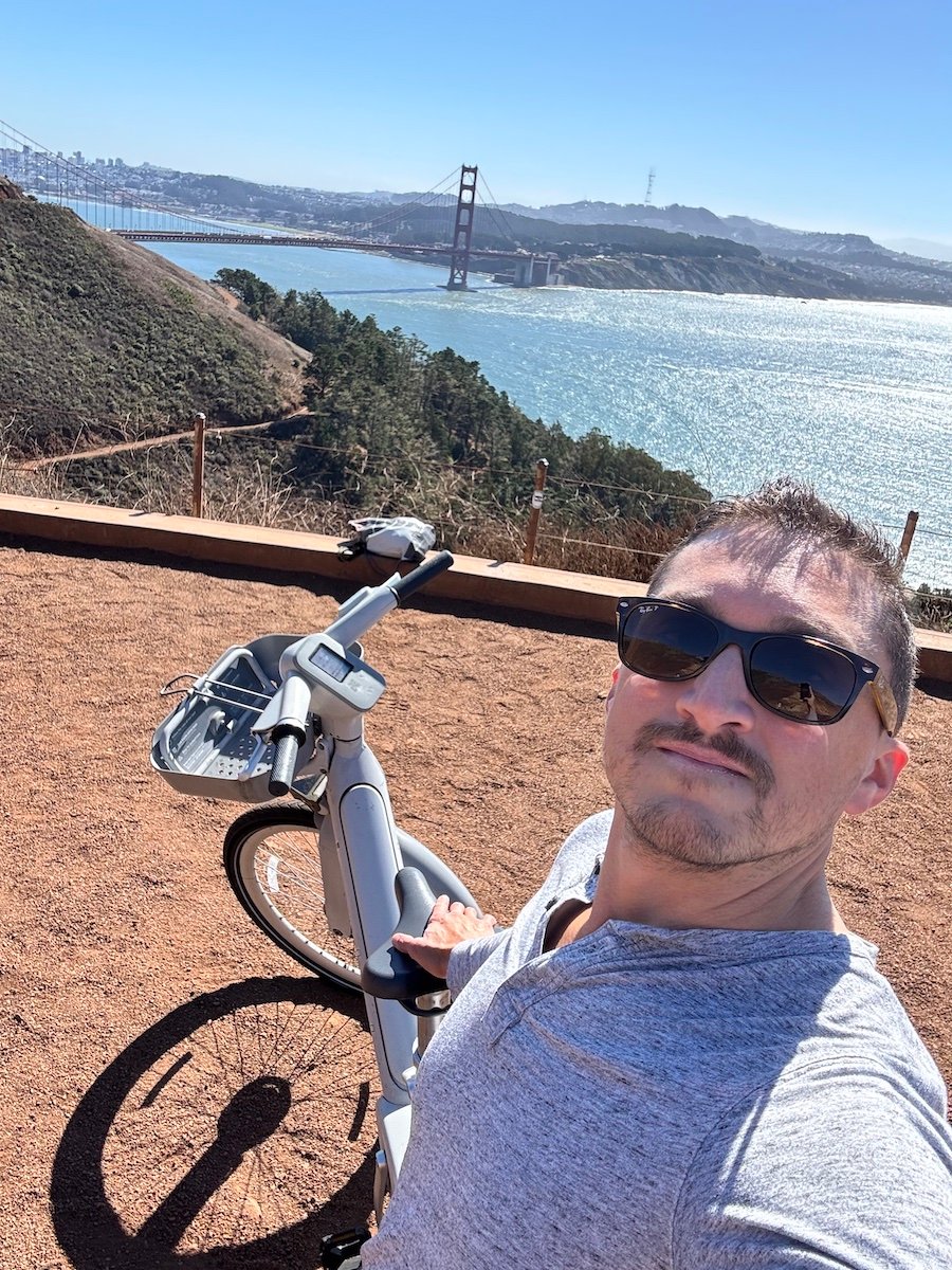 The author on a hill with the Golden Gate Bridge in the background.