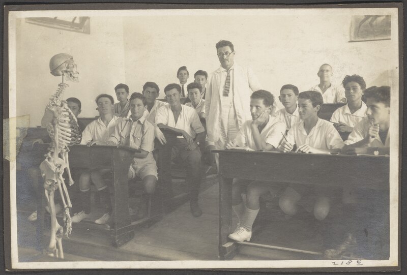 Classroom of students looking at a skeleton