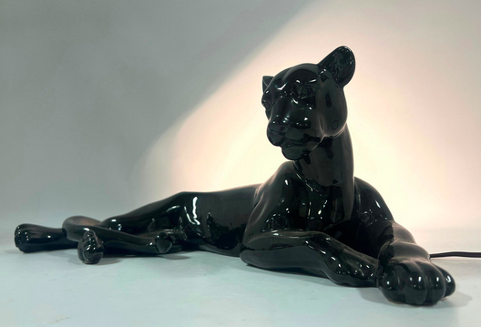 A midcentury lamp that looks like a blank panther