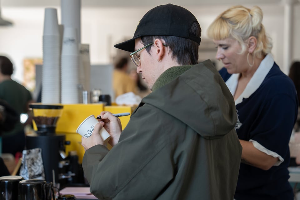 Elliot helping Beth with coffee.