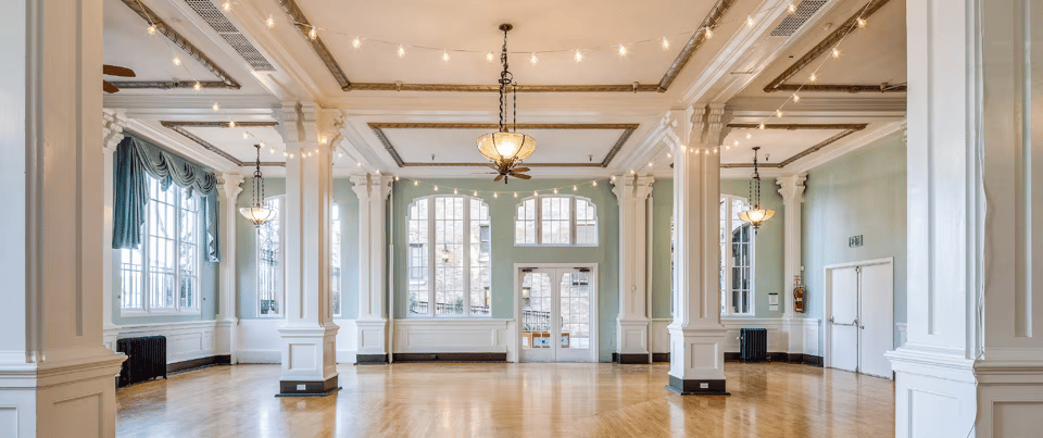 The Goldman Ballroom, from where we think our stage will be, at the Hotel Petaluma. It has a shiny wooden floor, a bunch of ornate columns, and big picture windows.