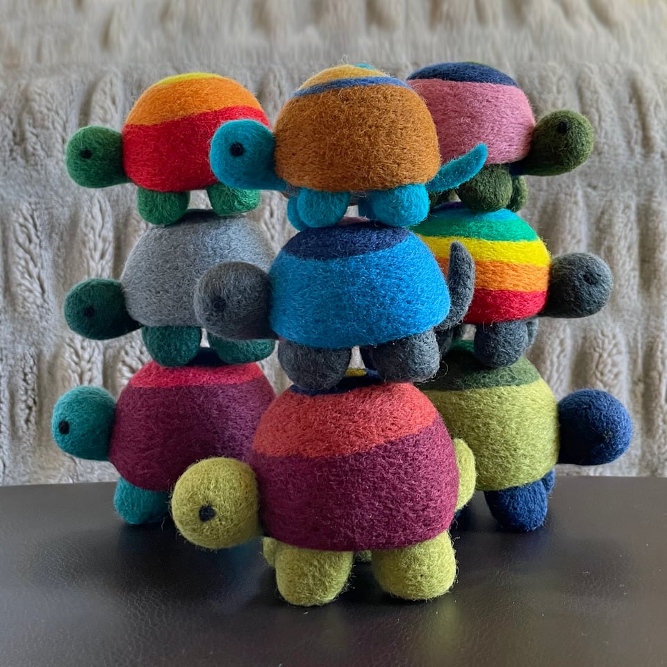 Nine needle-felted turtles