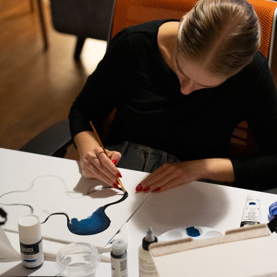 Halie painting a blob.