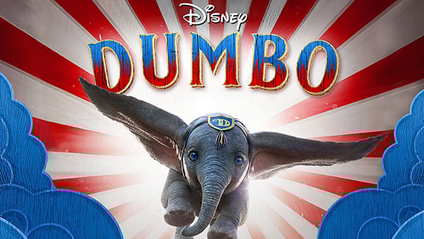 the logo of the Disney movie Dumbo, featuring Dumbo himself, a young elephant with big ears, flying toward the viewer.