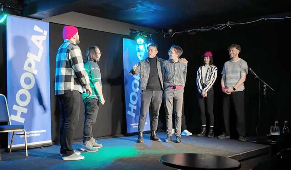 a group of people standing on stage