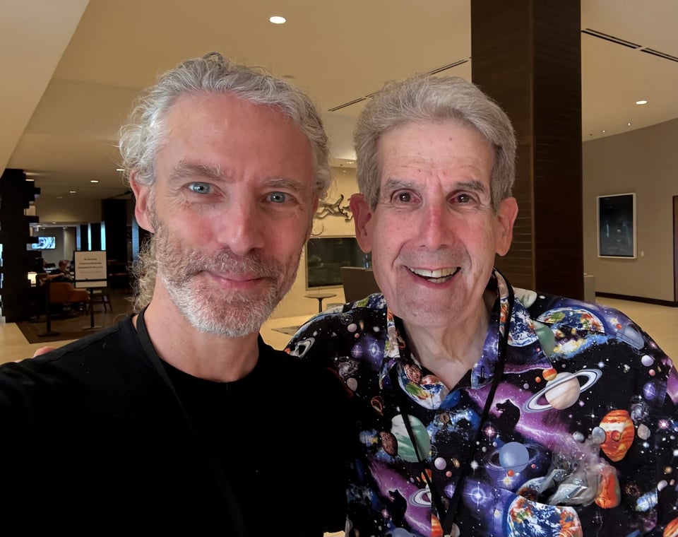 photo of 2 white men smiling for the camera