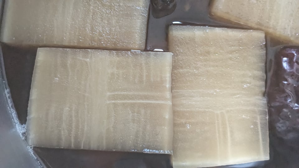 a close up of a cross-section through pieces of diakon radish.