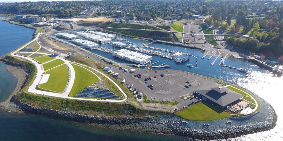 An aerial view of a marina and the nearby park named after the book