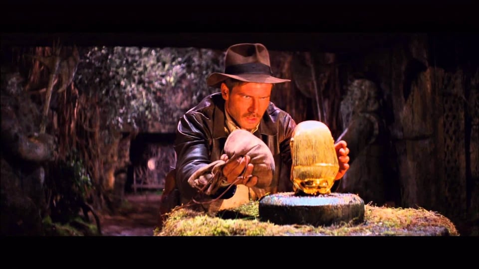 Indiana Jones weighs up the weight of a golden idol and if his bag of sand will be an exact equivalent and stop a trap being sprung