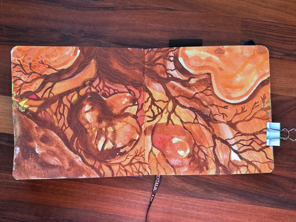 An abstract painting in brown hues across two pages in a sketchbook. The painting feels very warm and earthy, looking almost like a heart underneath the sprawling roots of a tree.