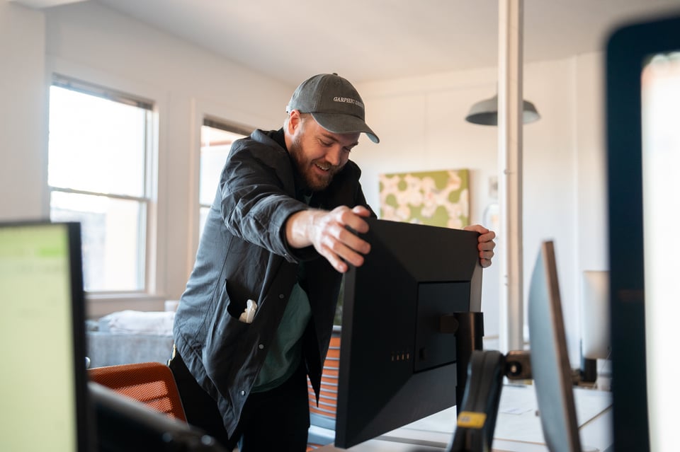 Chris setting up his monitor.