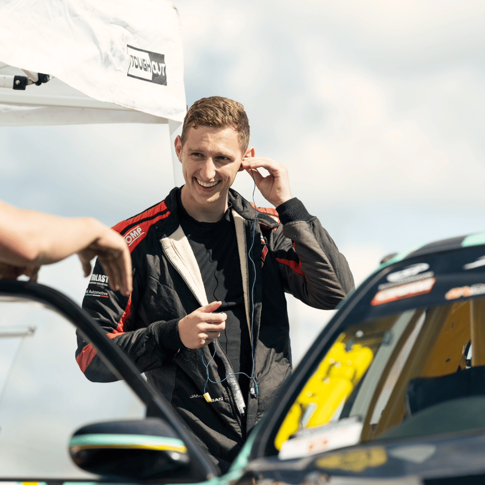 James Corban next to his honda cup car
