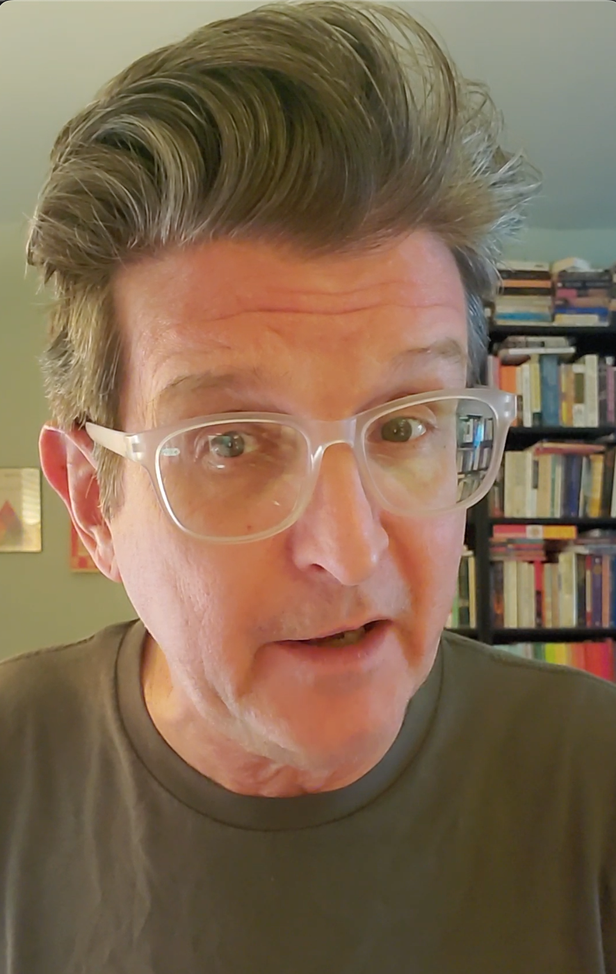 This is a screenshot of the linked video, in which Mercury Improv founder John Ratliff earnestly explaining to you why you probably want to sign up for the Improv for Introverts class starting next July 23rd