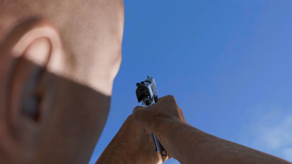 A man points a gun at a blue sky.