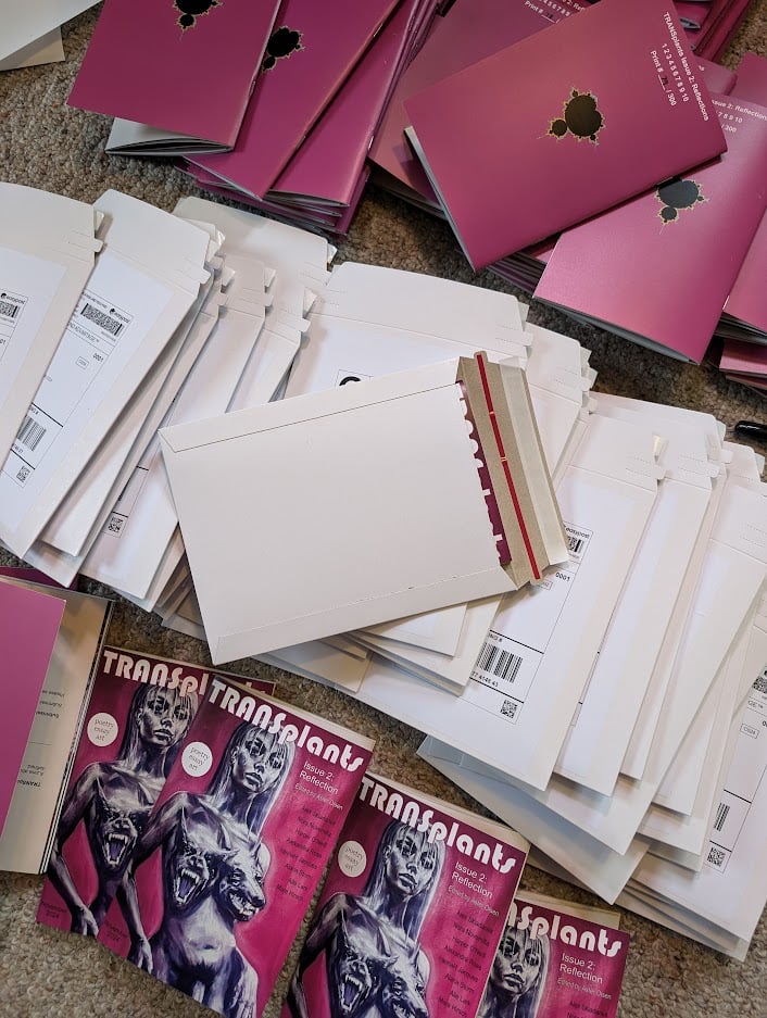 A mass of envelopes and zines ready for shipping