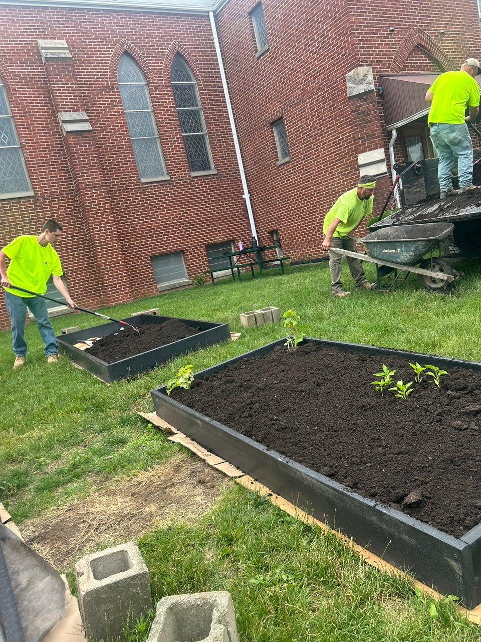 Soil going into gardening beds at the church.