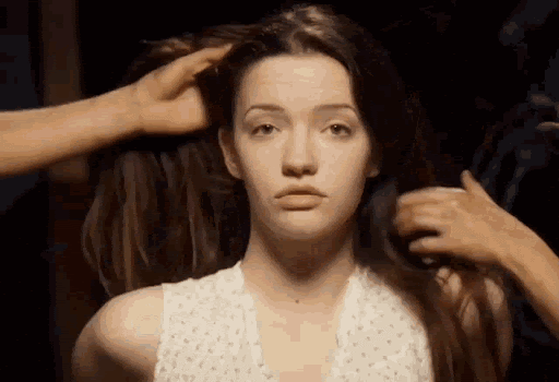 A gif of Annabelle from the movie St Trinian's receiving a rushed and chaotic makeover