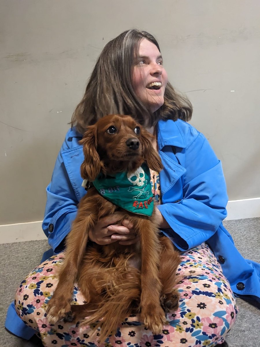 Radio dressed as a pirate being held by a beautiful lady.