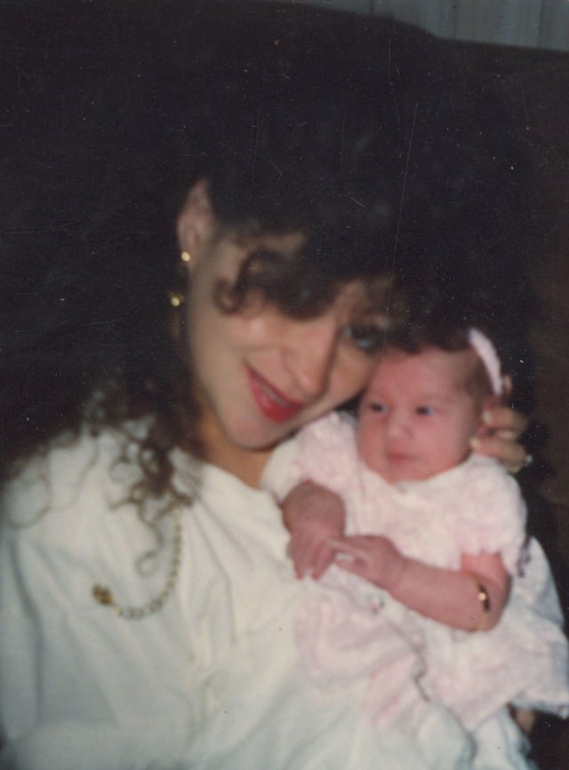 A young Dee Dee Blanchard holds her infant daughter, Gypsy Rose, in an early family snapshot.