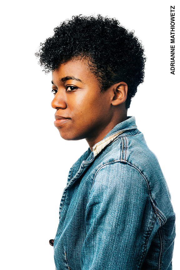 Photo of Phoebe looking to the side, wearing a jean jacket