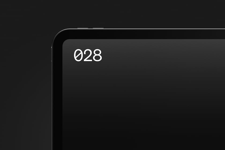 iPad crop displaying a gradient wallpaper with the number 028