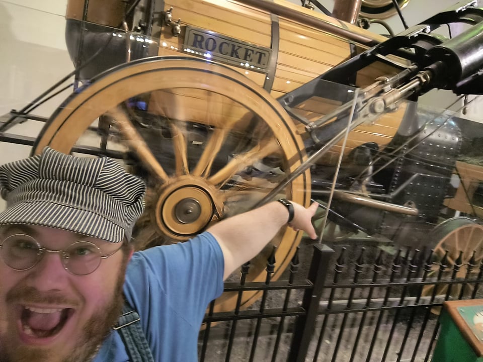 Me pointing at a replica of the Rocket
