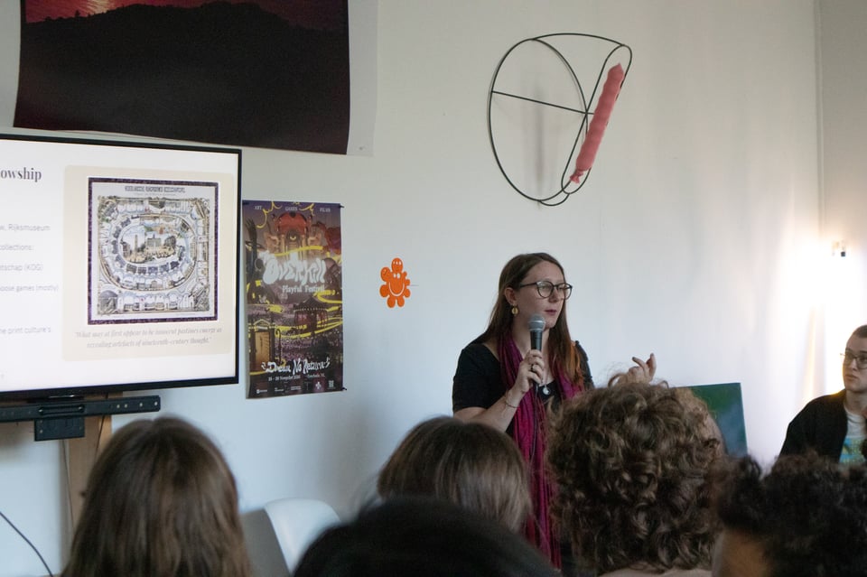 A presenter talking in front of an audience