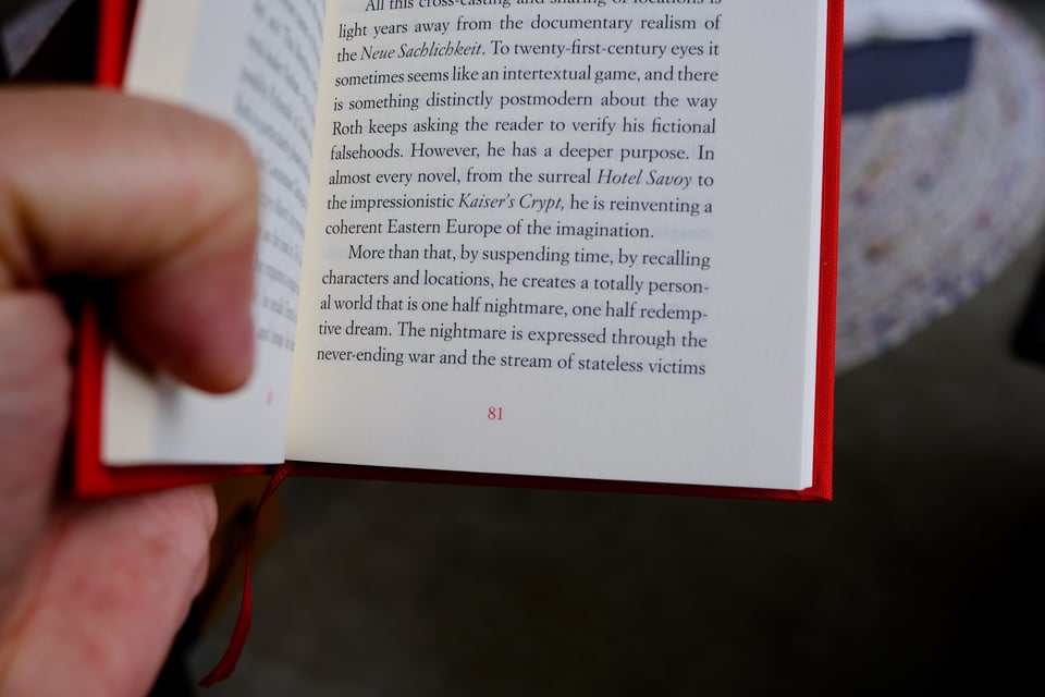 A book interior, highlighting the red page number at the bottom