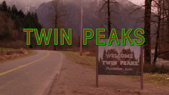 The title image from the opening credits of the show Twin Peaks, featuring a welcome sign and mountains in the background