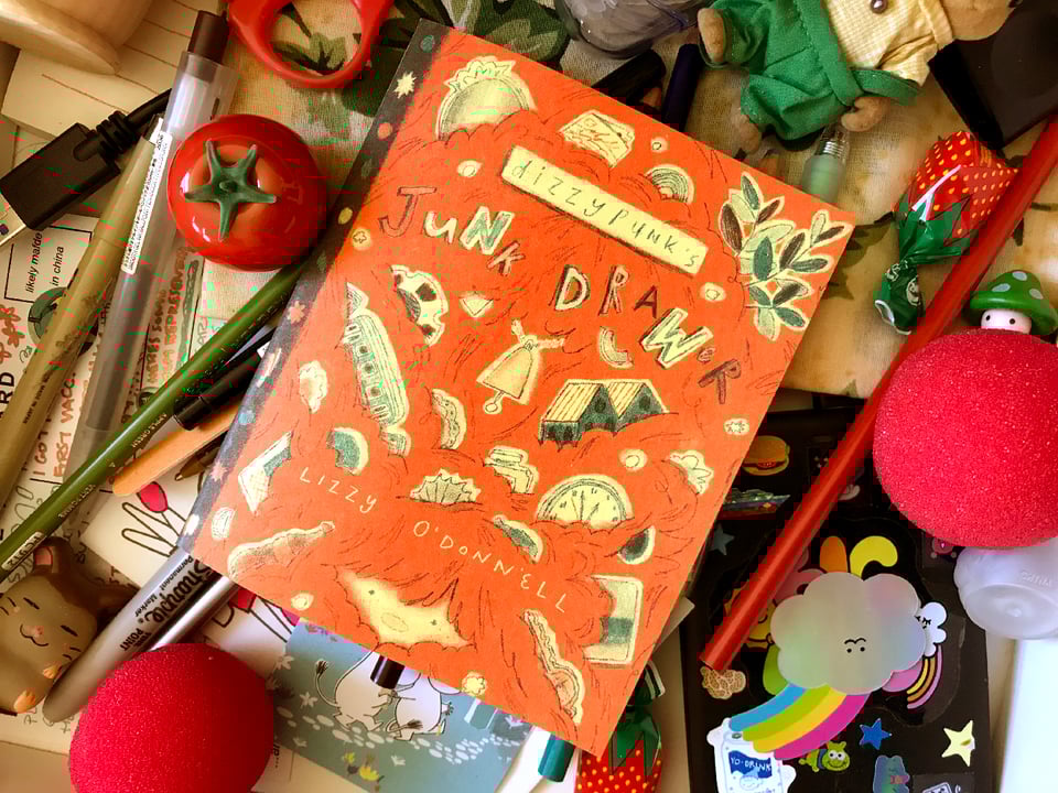 a picture of junk drawer, a zine printed in teal and red, by lizzy o'donnell! the cover says