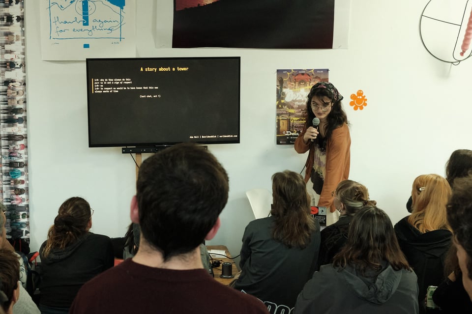 A speaker presenting in front of an audience