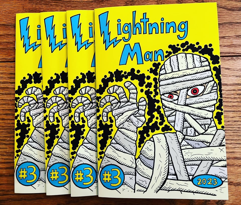 Four copies of the comic book Lightning Man #3 on a table