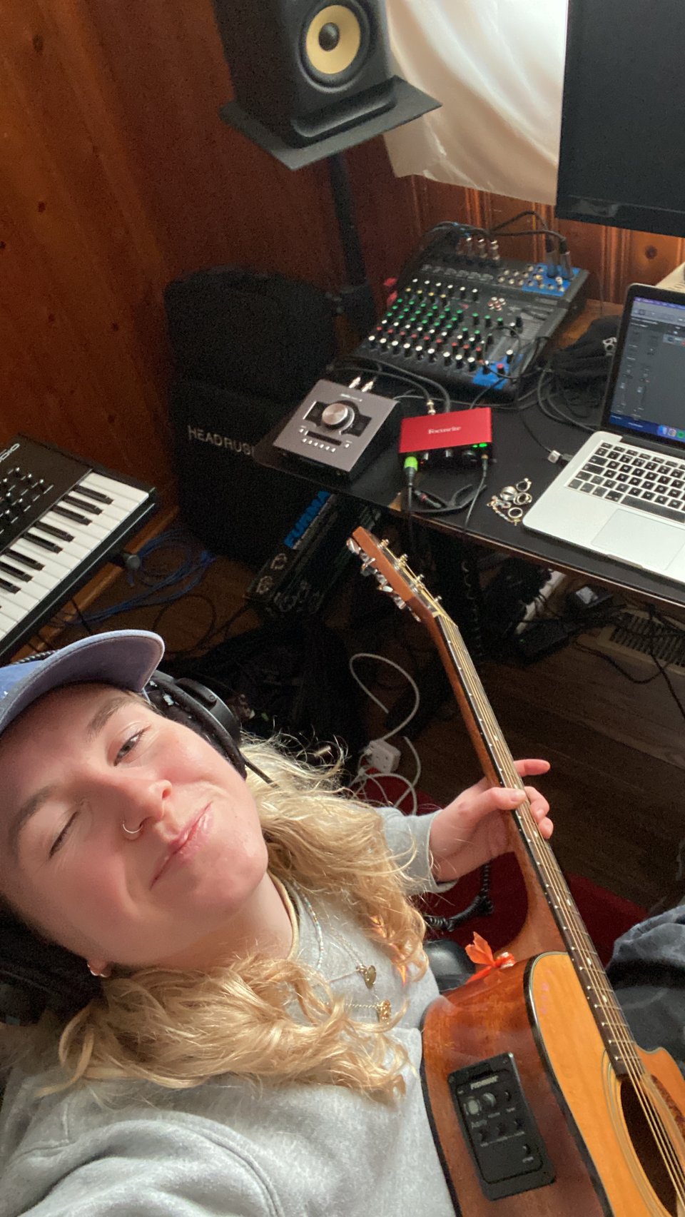 a woman playing an acoustic guitar