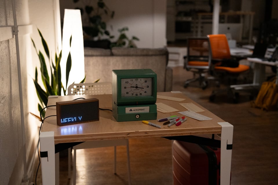 A time clock on a table.
