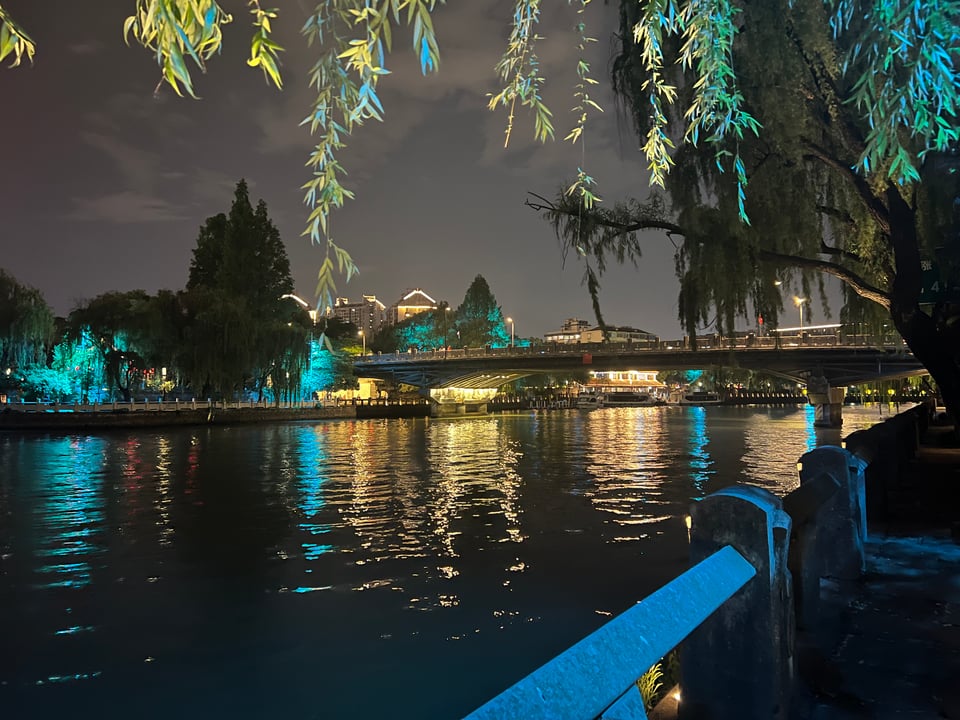 night scene of lights in hangzhou china by canal