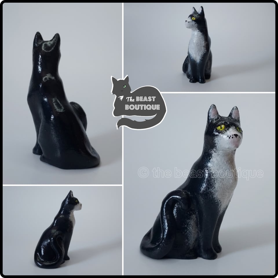 a collage of a sitting tuxedo cat figurine with green eyes from multiple different angles.