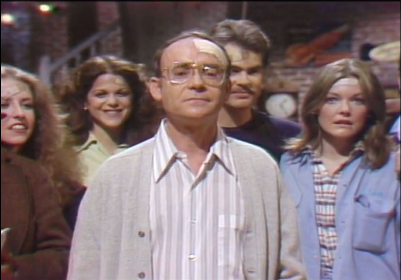 a man standing in front of a group of people